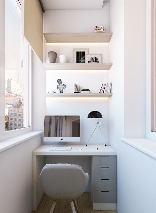 A small workspace in the balcony, a built in desk and shelves with .
