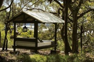 Bed outside. Beach Retreat For Relaxation In A Eucalypti Wood .
