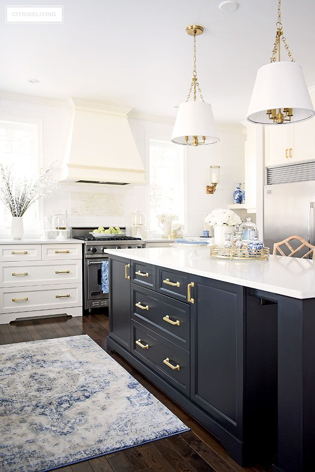 Beautiful kitchen with spring decorating - white cupboards, black .