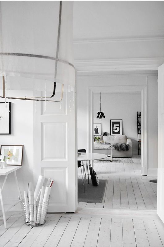 Calm And Casual House Designed In White And Light Grey Colors .