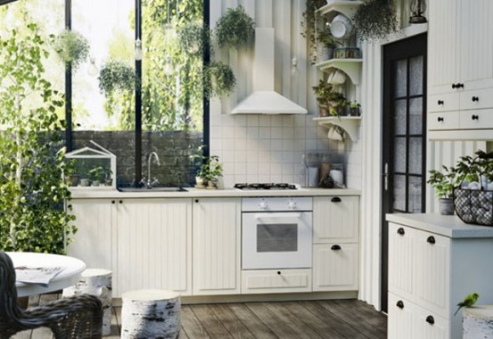 Completely White Kitchen With Lots Of Greenery - DigsDi