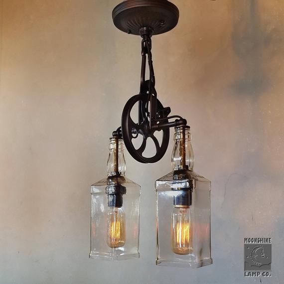 This dual pendant fixture reminds us of the old gas lamp fixtures .