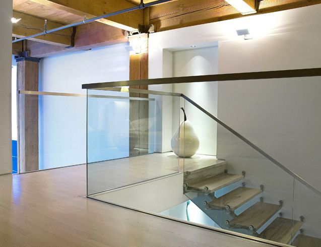Contemporary Loft Design With an Artistic Interior Staircase .