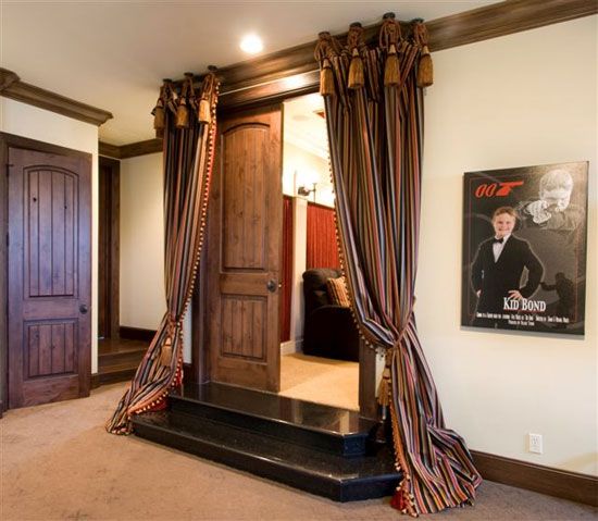 Dramatic Home Theater Design With Curtains on Every Wall .