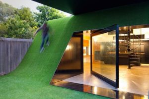 House with Artificial Hill and Synthetic Grass by Andrew Maynard .