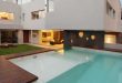 Devoto House with Fantastic Elevated Swimming Pool by Andres Remy .