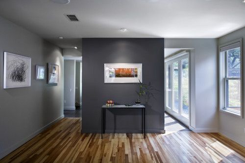 Using cool charcoal as an accent in a lighter gray room is the .