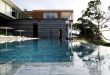 Luxury Modern Villa With Infinite Water Surface - DigsDi