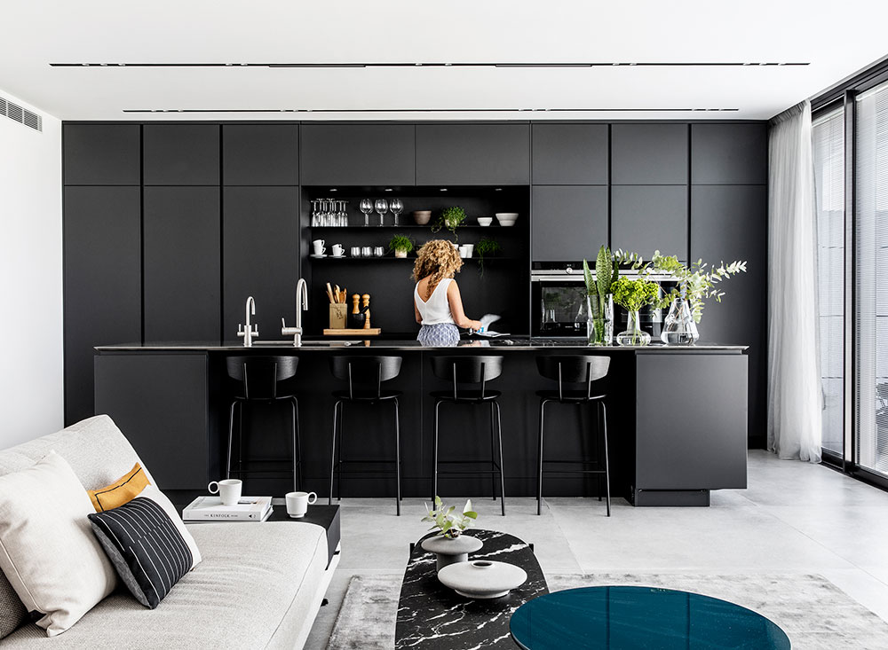 Minimal black and white apartment with terrace in Tel Aviv .