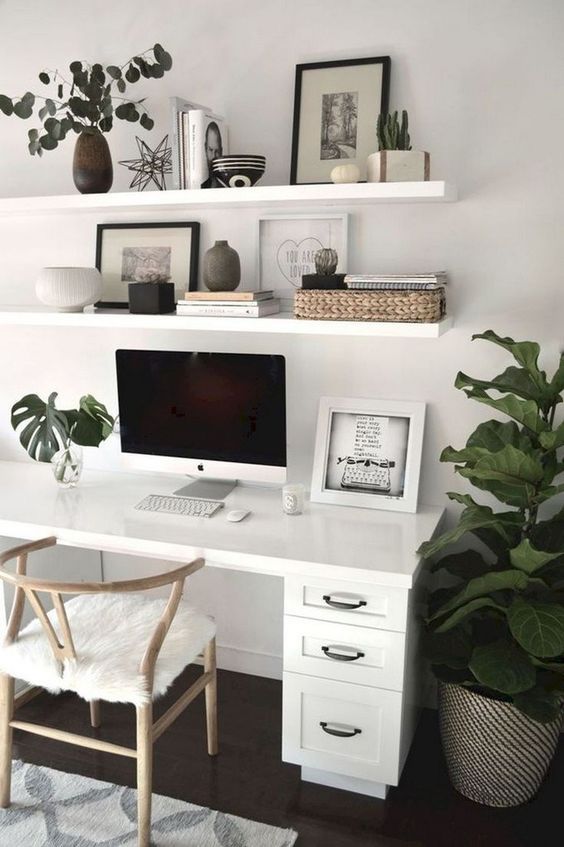 Modern home office, plants, white desk, wall art, minimalist .