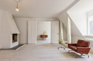 Minimalist Stockholm Apartment Designed With Bright Orange Accents .
