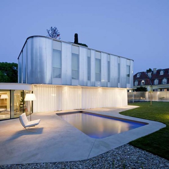Modern House With Curved Architecture And A Touch Of Nature - DigsDi
