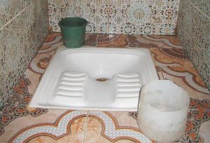 Traditional toilets in Morocco are holes in the ground surrounded .
