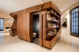 Modern Loft With a Freestanding Centralized Wood Veneer Kitchen .