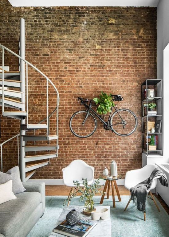 Industrial Interior Décor With An Exposed Brick Wall With A Bike .