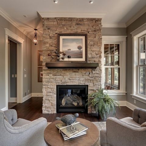 Gray Stacked Stone Fireplace With Black Hearth Design Ideas .