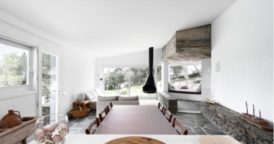 Rustic House With Massive Rock Formations In The Interior