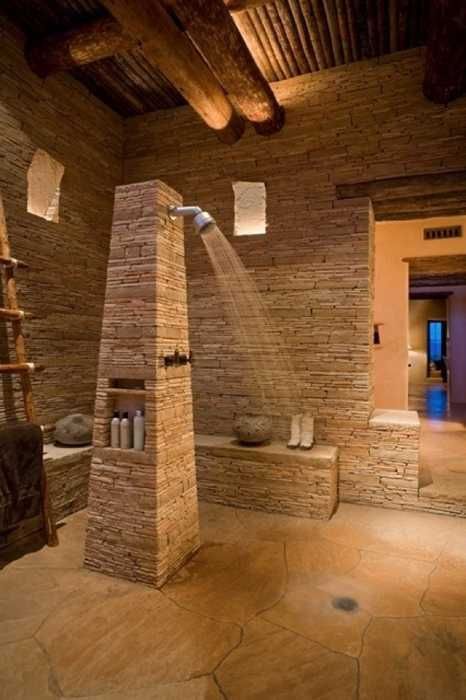 Sculptural Rough Stone Bathroom Design