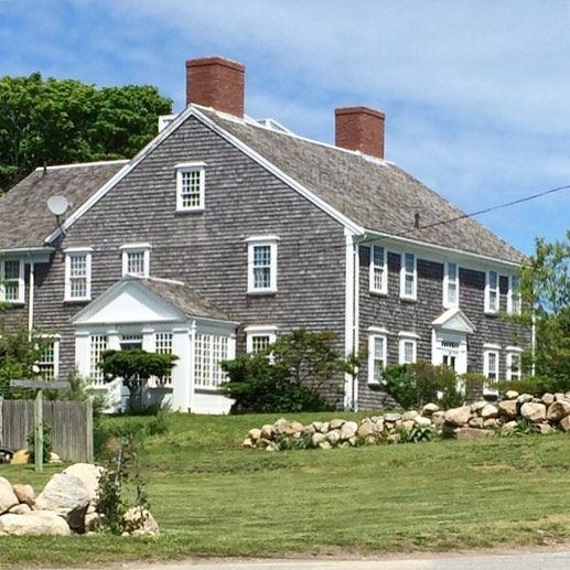 Weathered shingles and white trim.... classic Cape Cod home .