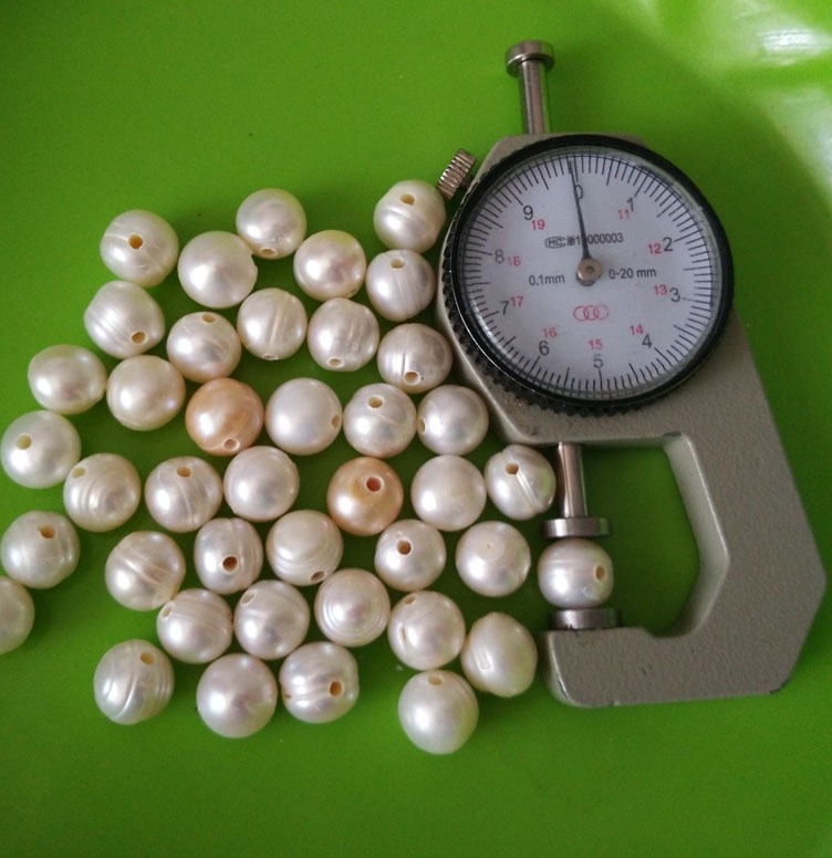 2.5mm Large Hole Grade A 10mm Oval White Shaped Freshwater Pearls .