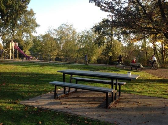 picnic tables, kids playground, benches facing the lake, biking .